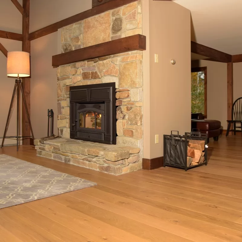 Living room, fireplace scene with wood-look luxury vinyl plank.