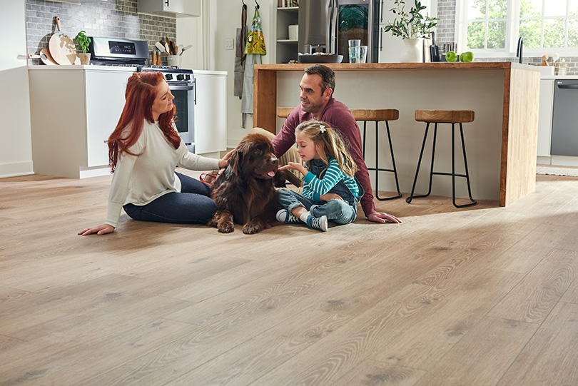 Family in kitchen with LVP flooring